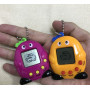 Дитяча іграшка брелок Тамагочі Tamagotchi оригінальна кишенькова тварина жовта